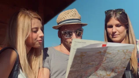 Handheld shot of friends checking map outdoors Stock-Footage 55041624