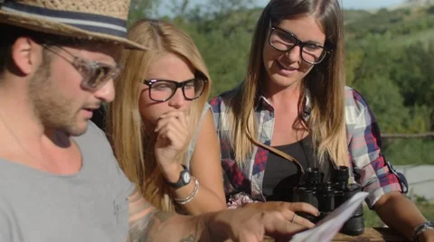 Handheld shot of friends checking map outdoors Stock-Footage 55050206