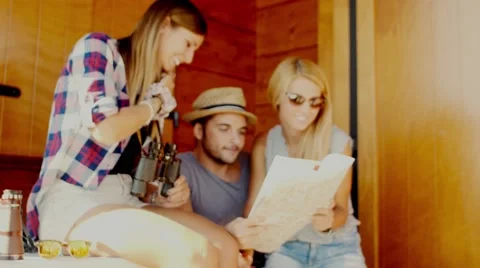 Handheld shot of friends checking map Stock Footage 55076365