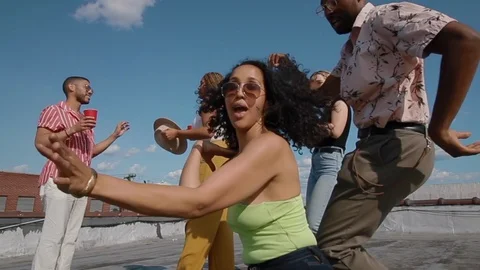 Handheld shot of friends dancing on the building terrace Video stock 114880838