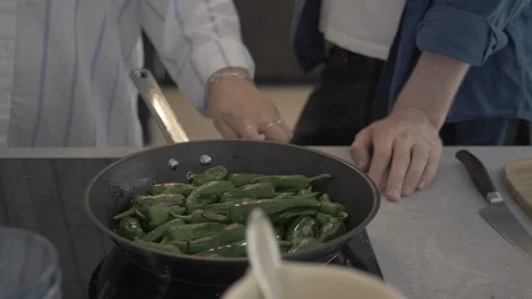 Handheld shot of friends having fun while preparing vegetables Stock Footage 114842301