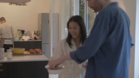 Handheld shot of friends setting table for meal Video stock 114842442