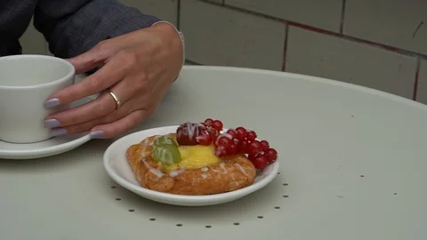 Handheld shot of fruit pastry on table at sidewalk cafe 스톡 동영상 114849873