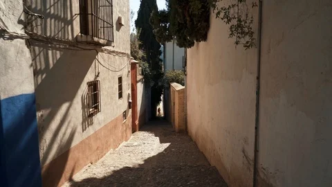Handheld shot of going down between houses in Ronda city Stock-Footage 124739537