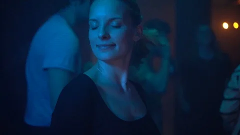 Handheld shot of group of friends having fun at the nightclub Stock Footage 114877752