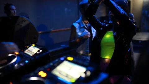 Handheld shot of group of people dancing around the DJ Console Stock Footage 114886145