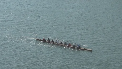 Handheld shot of group of people rowing in a boat in the sea Video stock 120064989