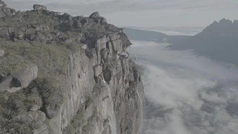 Handheld shot of helicopter approaching the top of Angel Falls, Venezuela  Vídeos de archivo 248708972