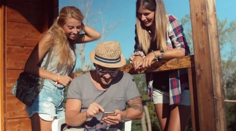 Handheld shot of hikers checking position on smartphone Stock Footage 55028756
