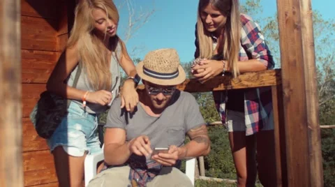 Handheld shot of hikers checking position on smartphone Video stock 55032488