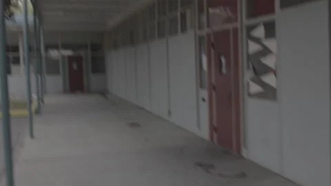 Handheld shot inside abandoned school Stock Footage 252289486