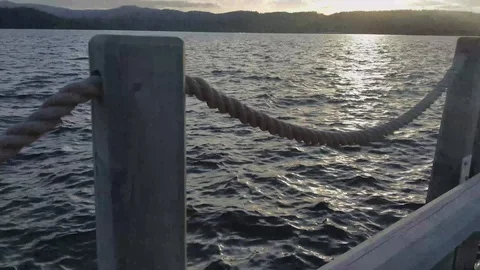 Handheld shot of the lake off a dock Stock Footage 91831113