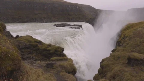Handheld shot of large waterfall with mist during day time Stock Footage 118654822