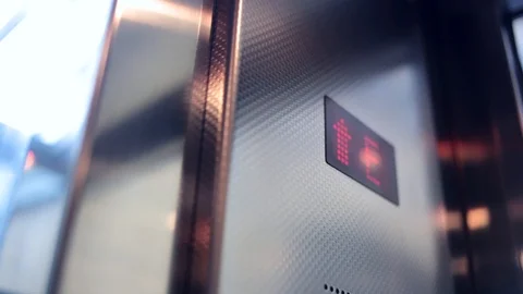 Handheld shot of LCD display in elevator Stock Footage 96219901