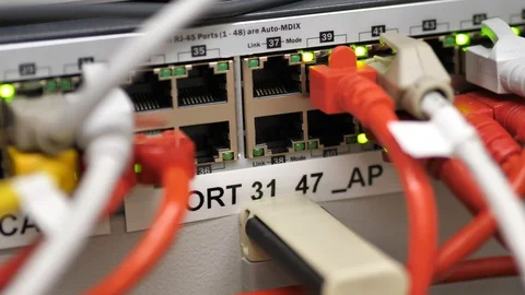 Handheld Shot Of LED Lights Blinding On Back Of Server Switch Stock Footage 127715417