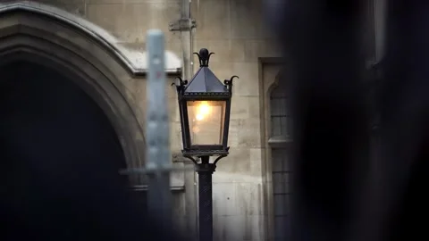 Handheld Shot of Lit Lamp Outside Royal Courts of Justice, London Stock Footage 286136550