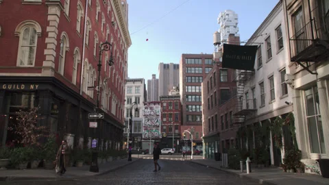Handheld shot of a Lower Manhattan intersection at sunrise Stock Footage 327802980
