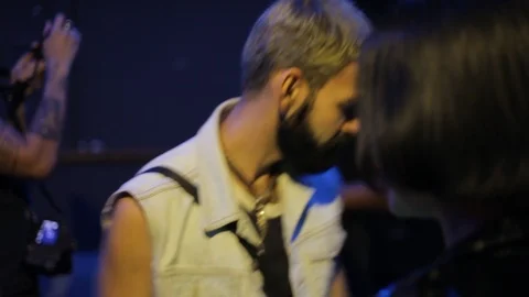 Handheld shot of man with black beard dancing in nightclub 스톡 동영상 114847487
