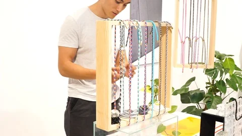 Handheld shot of a man browsing items at a store 스톡 동영상 114884453