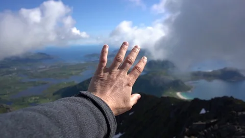 Handheld shot of a man moving his hand against sky Video stock 114881554