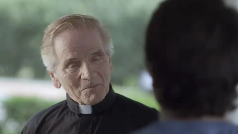 Handheld shot of a Man talking to priest at doorstep - Reenactment Stock Footage 202913232