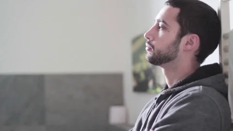 Handheld Shot of Man Thinking in a Room Stock Footage 72369345
