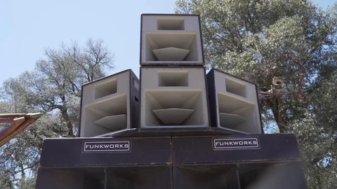 Handheld shot of massive speaker system at outdoor music festival, San Diego Stock Footage 121710609