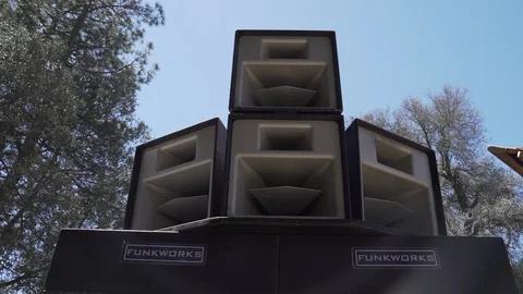 Handheld shot of massive speaker system at outdoor music festival, San Diego Stock Footage 121710694