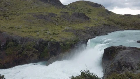 Handheld shot of mighty waterfall on mountain river, Patagonia, Chile Video stock 137958725