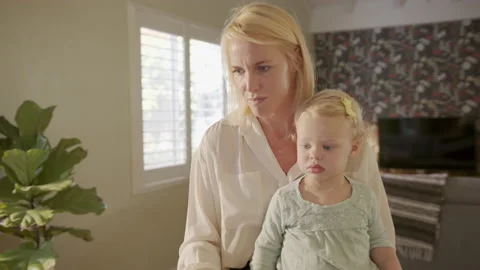 Handheld Shot of Mother Answering Emails from Home While Parenting Stock Footage 133288288