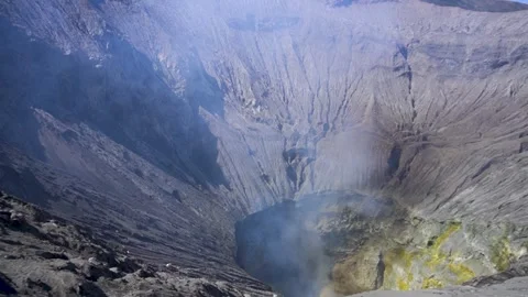 Handheld shot of Mount Bromo crater with smoke in East Java Stock Footage 299895005