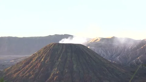 Handheld shot of Mount Bromo volcano with smoke coming out in East Java 動画素材 299894981