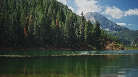 Handheld shot of Mountain Peak behind lake Stock Footage 127461395