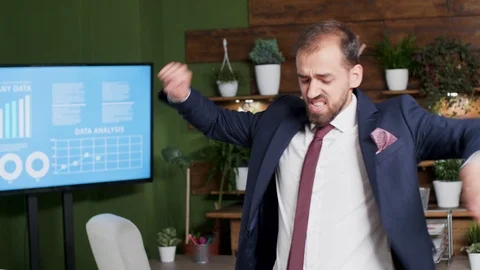 Handheld shot of office worker dancing Stock Footage 109610668