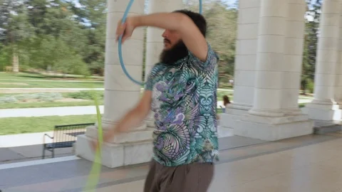 Handheld Shot Orbiting a Hoop Flow Artist Stock Footage 111343586