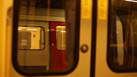 Handheld shot of passenger train leaving from platform Stock Footage 114841742