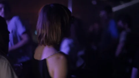 Handheld shot of people dancing on dance floor Stock Footage 114848364