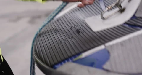 Handheld shot of pro surfer David Langer explaining issues within wakesurfing Stock Footage 160540688