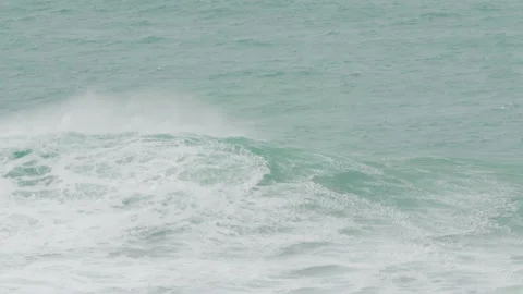 Handheld shot professional surfer getting carried by another surfer on jet ski Stock Footage 157157153