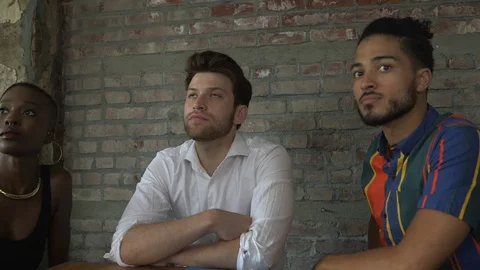 Handheld shot of serious co-workers listening to businesswoman during meeting Stock Footage 114855668