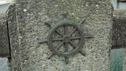 Handheld shot of ships wheel on post in Seattle Stock Footage 73498161