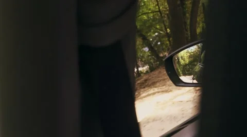 Handheld Shot of Side View Mirror, Driving on the Road Stock Footage 65789276