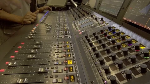 Handheld Shot of Sound Engineer Teaching Digital Audio Mixing Equipment Stock Footage 104886225