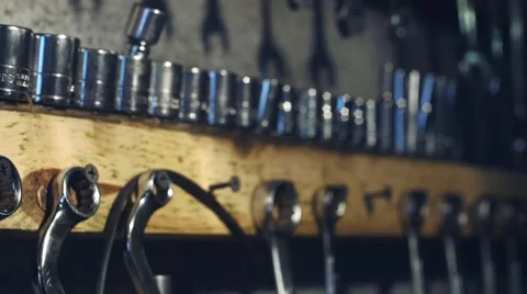 Handheld shot of spanners and tools mounted to wall Stock Footage 65062573