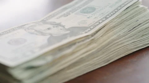 Handheld shot of a stack of cash. Stock Footage 149801753