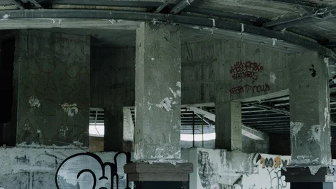 Handheld shot of structure in an abandoned warehouse Stock Footage 112895794