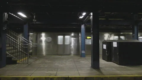 Handheld shot of a subway train leaving the station Stock Footage 262711583