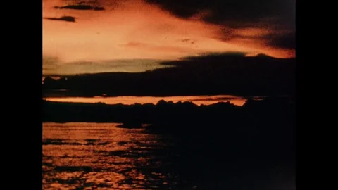 Handheld shot of a sun setting behind the hills, south africa, 1939 Stock Footage 132319015