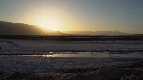 Handheld shot at sunset over a salt creek. Video stock 155444890