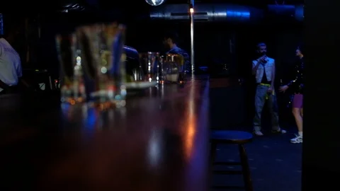 Handheld shot of three people dancing in the club Video stock 114886113